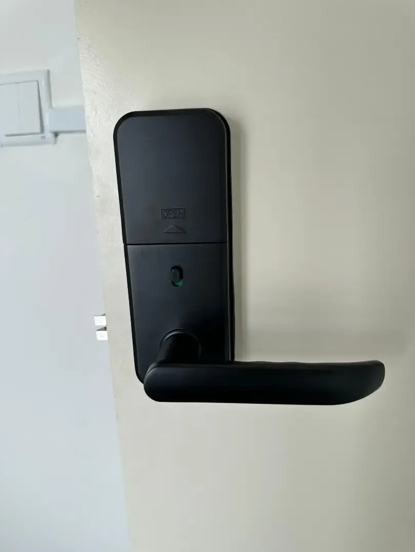 A close view of a smart door lock keypad.