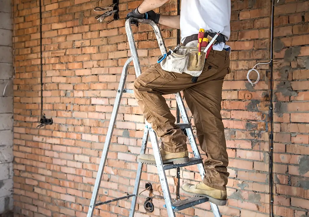 electrician-with-tools-working-construction-site-repair-handyman-concept copy