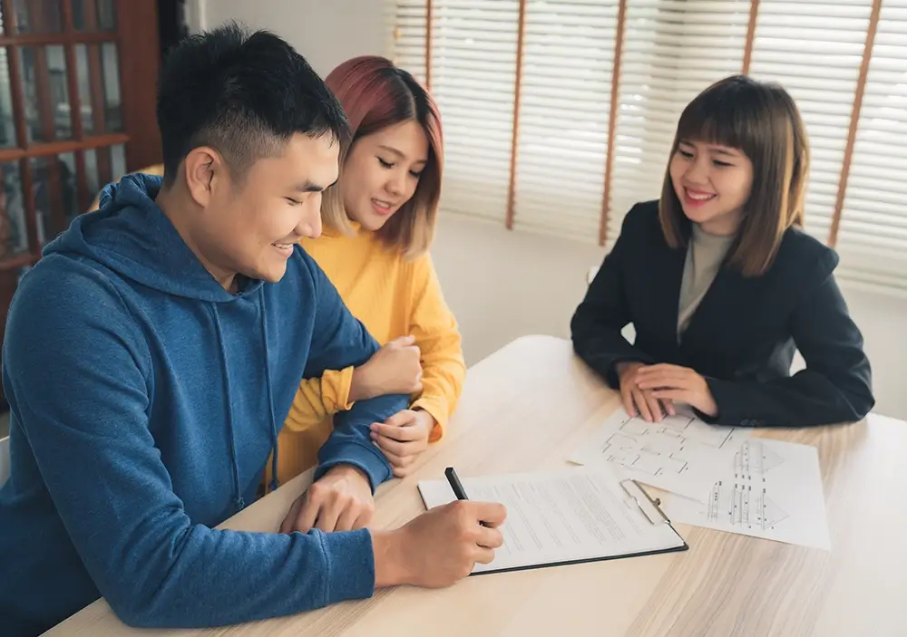 happy-young-asian-couple-realtor-agent copy
